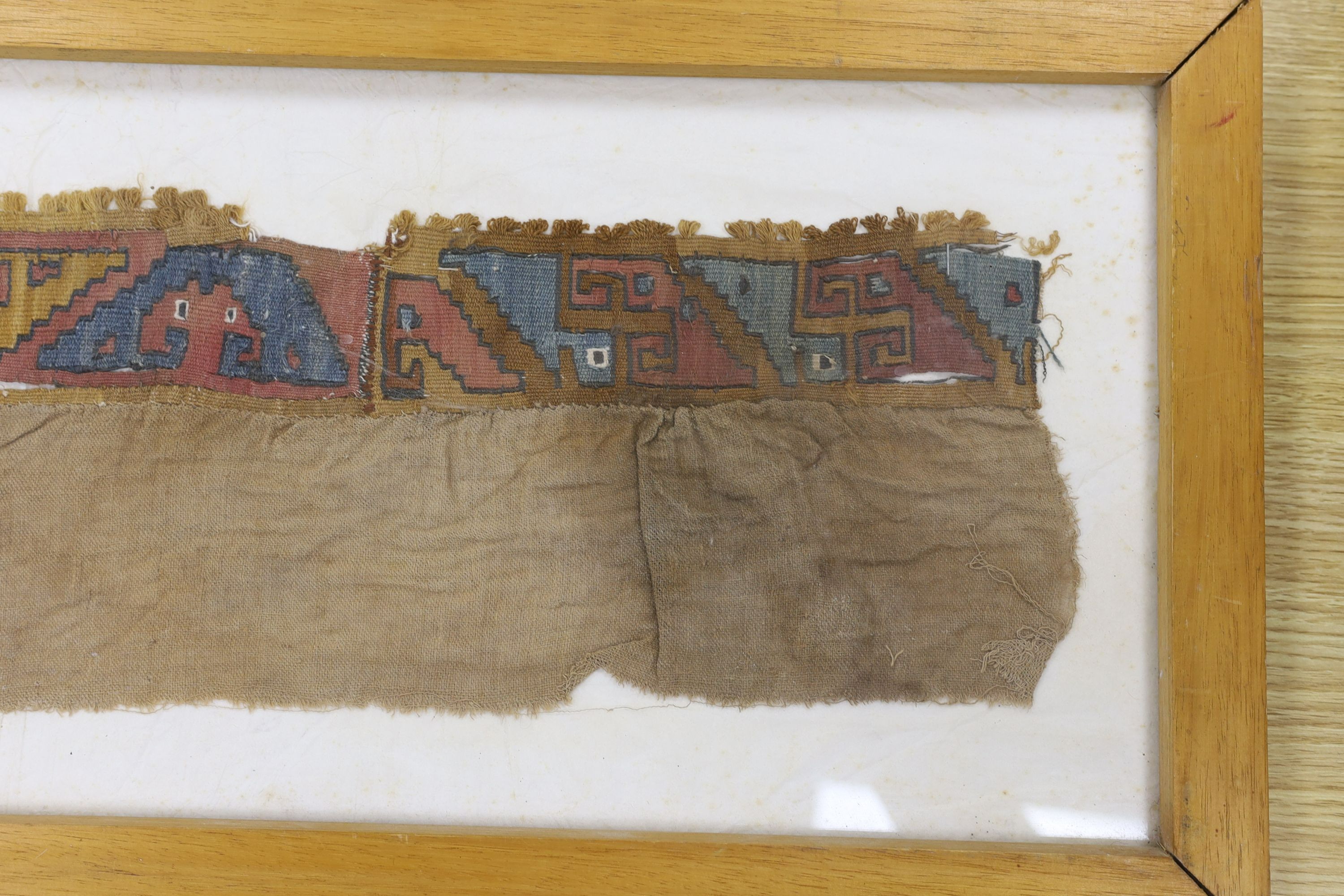 A pre-Columbian grave textile, framed